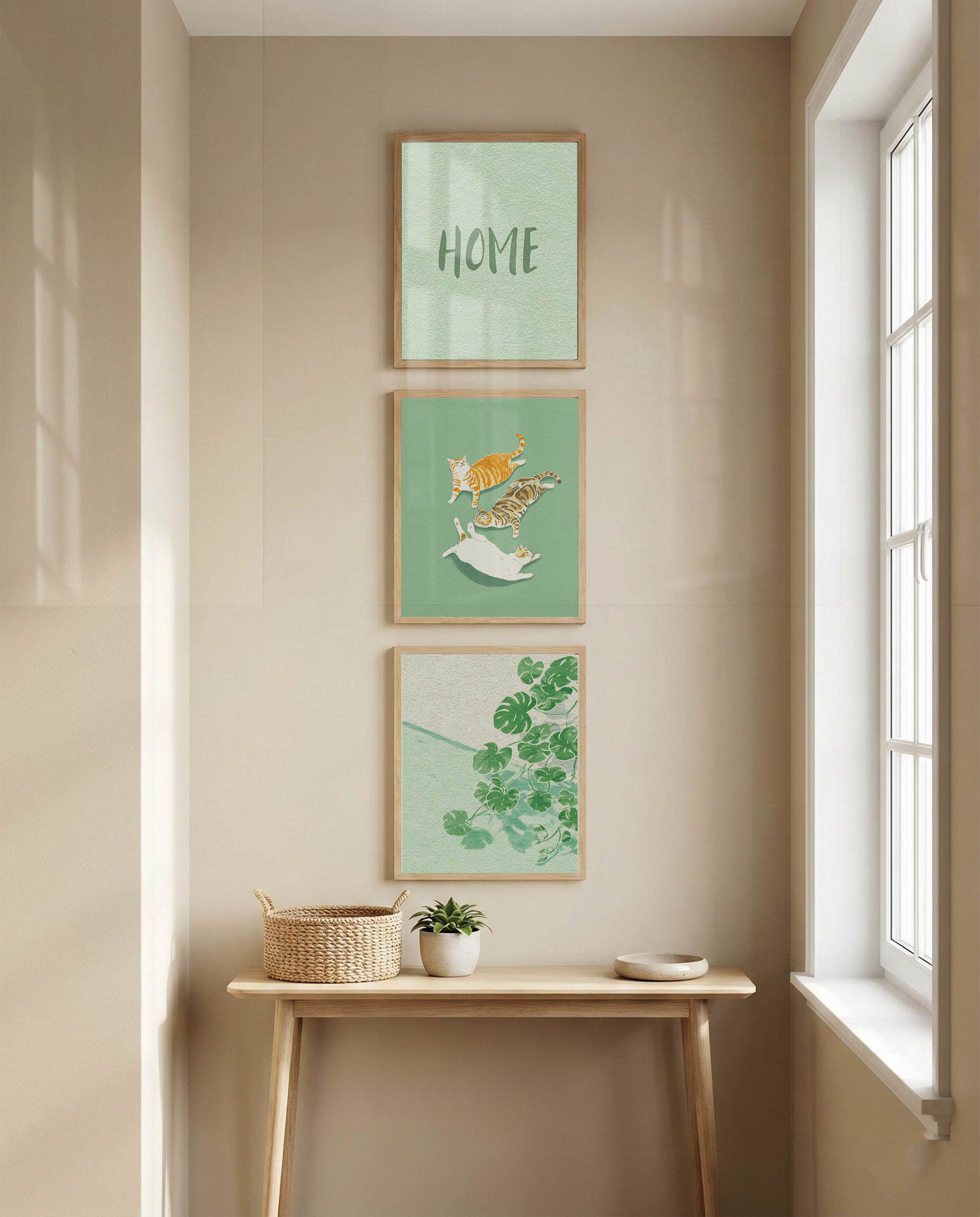 Narrow vertical wall between a doorway and a window with three small black-framed art prints stacked vertically